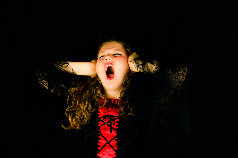 difficult student covering ears and screaming