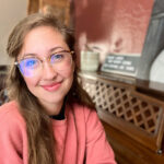 alyssa villagrana, owner of C&S music, headshot in front of piano