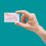 a hand holding a unique gift card